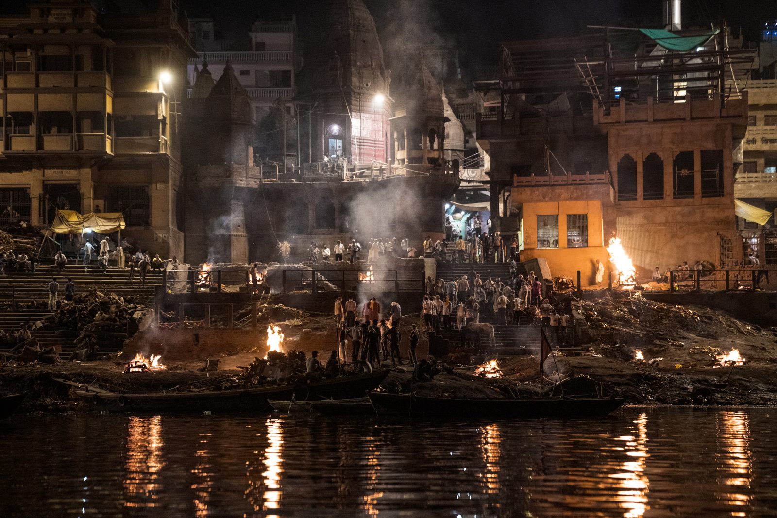 Bodies of the recently deceased burning on cremation pyres in Uttar Pradesh, India