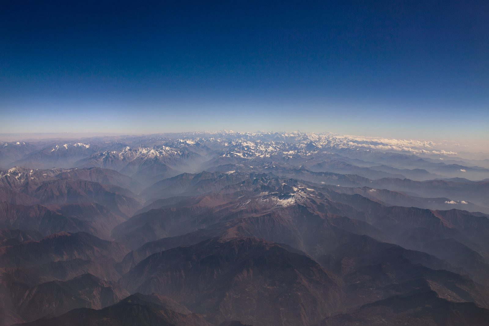 Smoke fills the remote Himalayan mountain valleys above India
