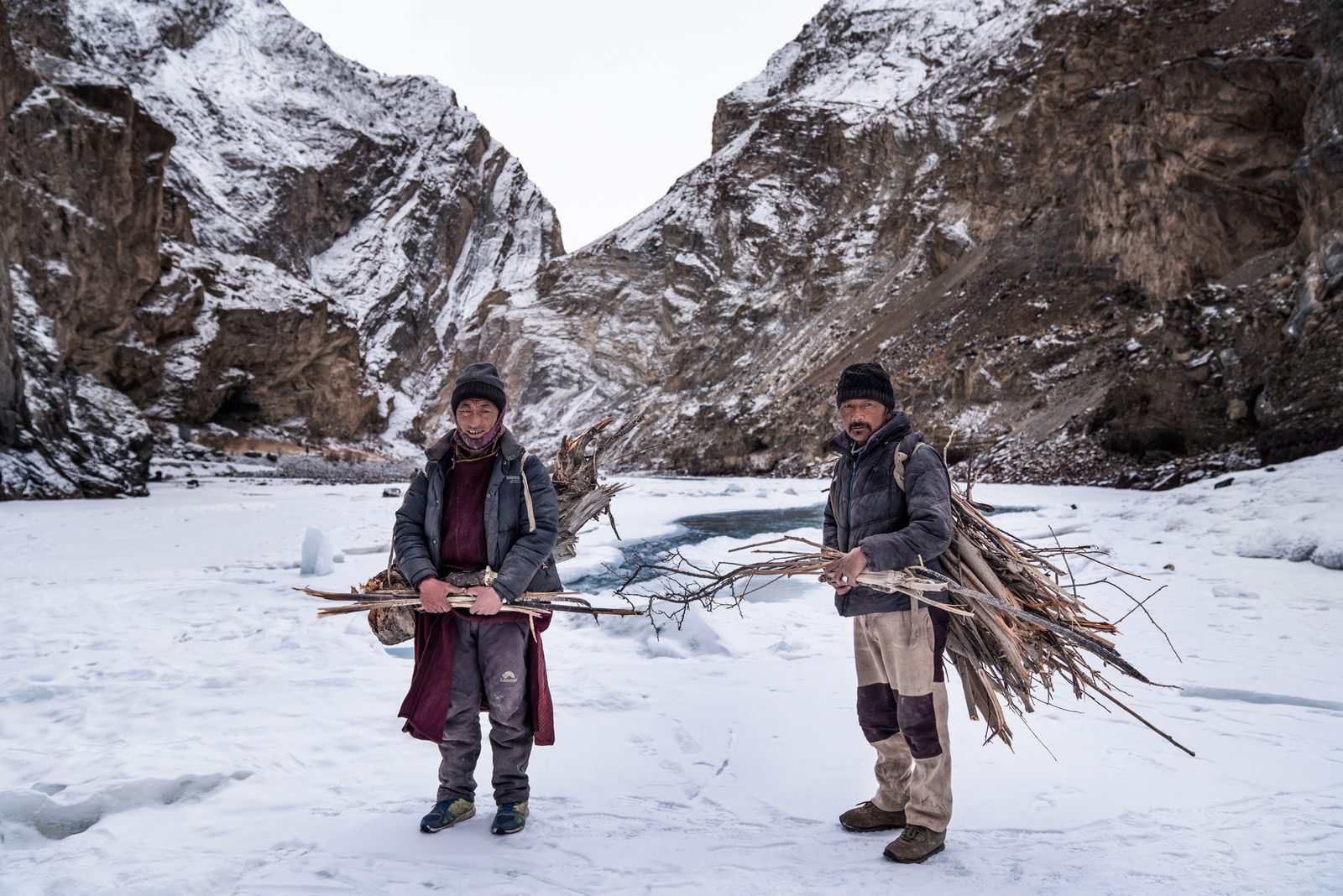 Two Zanskari men stand for a portrait after collecting driftwood for a fire along the Zanskar River