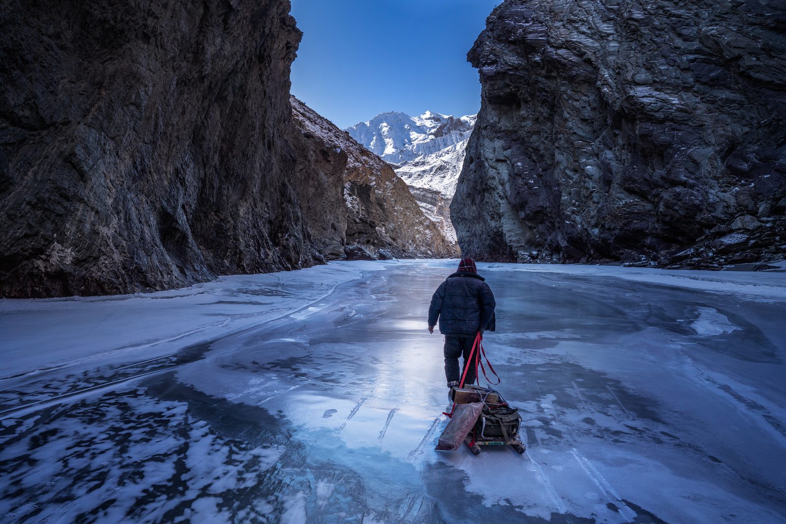 A zanskari man scurries across Wama, the infamous section of the frozen Zanskar River