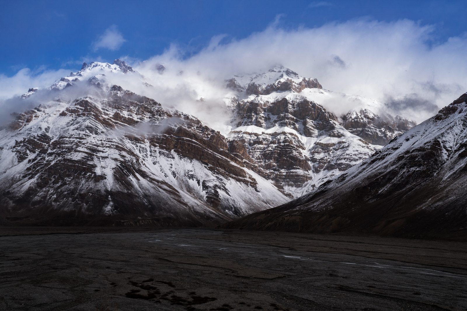 Clouds begin to disperse after a blizzard in India's Spiti Valley