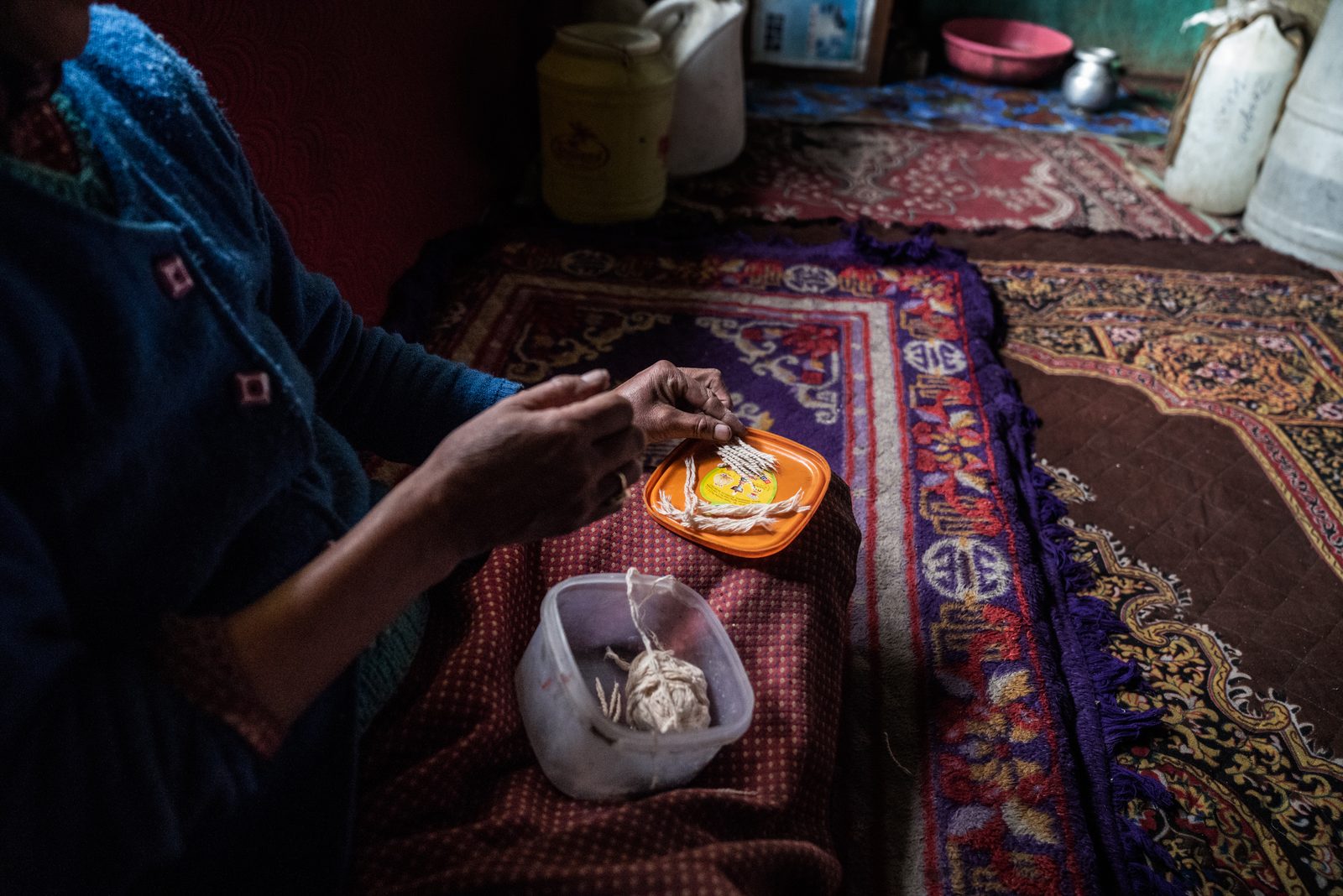 Tsewang Zangmo weaves candle wicks