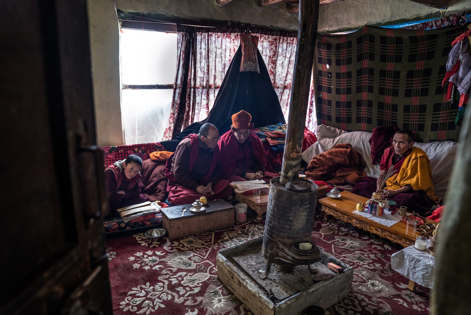 Buddhist monks from a monastery outside of Kumik visits the village to perform a funeral ceremony