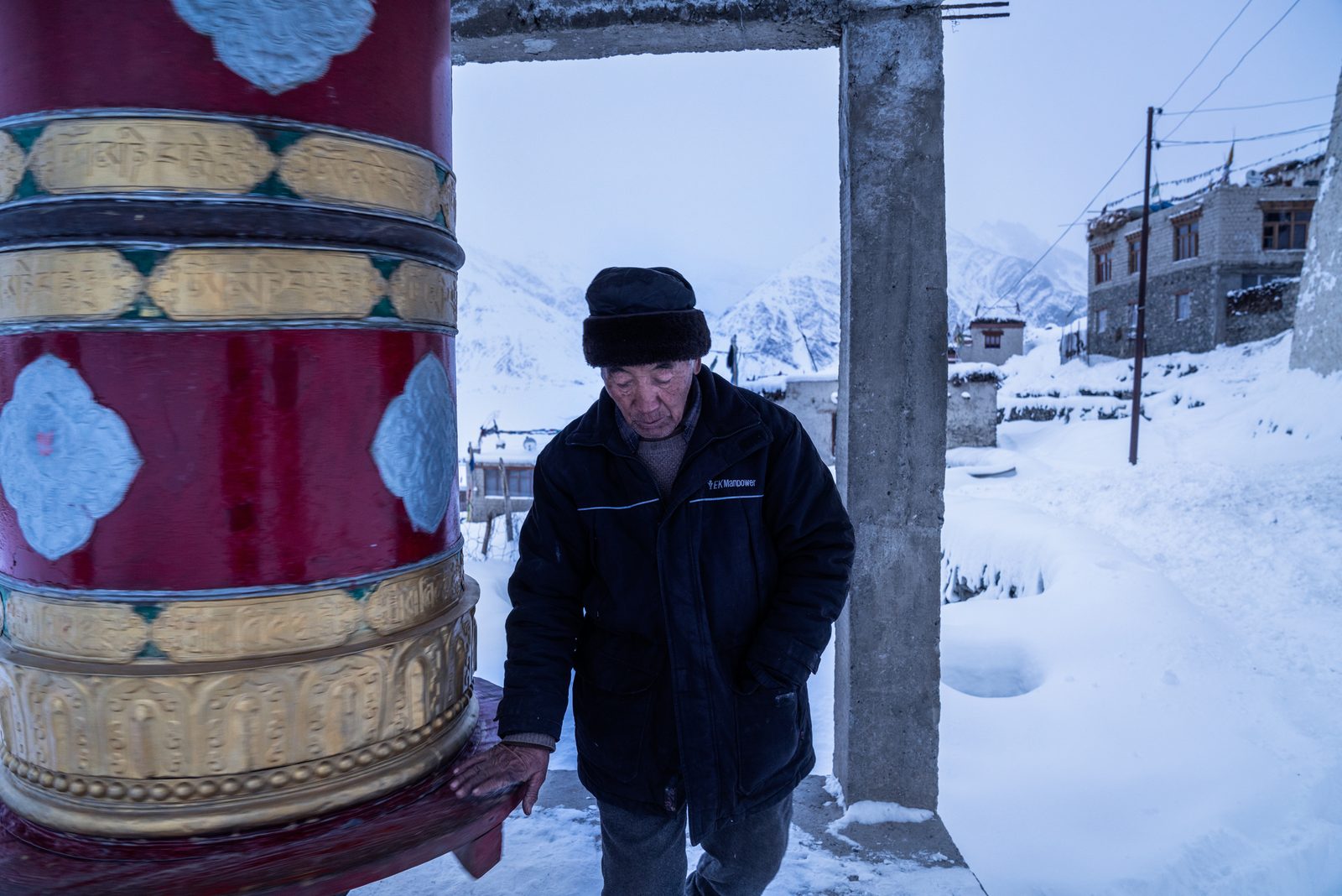 Sonam Gallic spins one of Kumik's many prayer wheels during his afternoon ritual