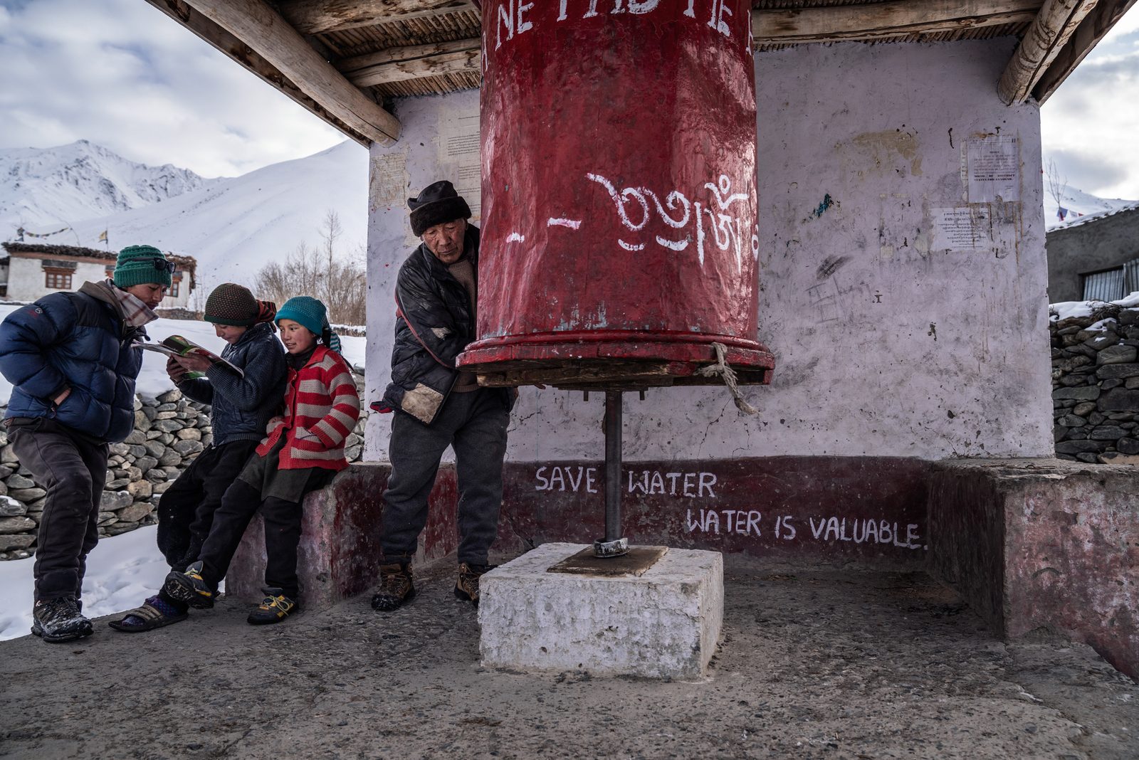Sonam Gallic spins the village prayer wheel