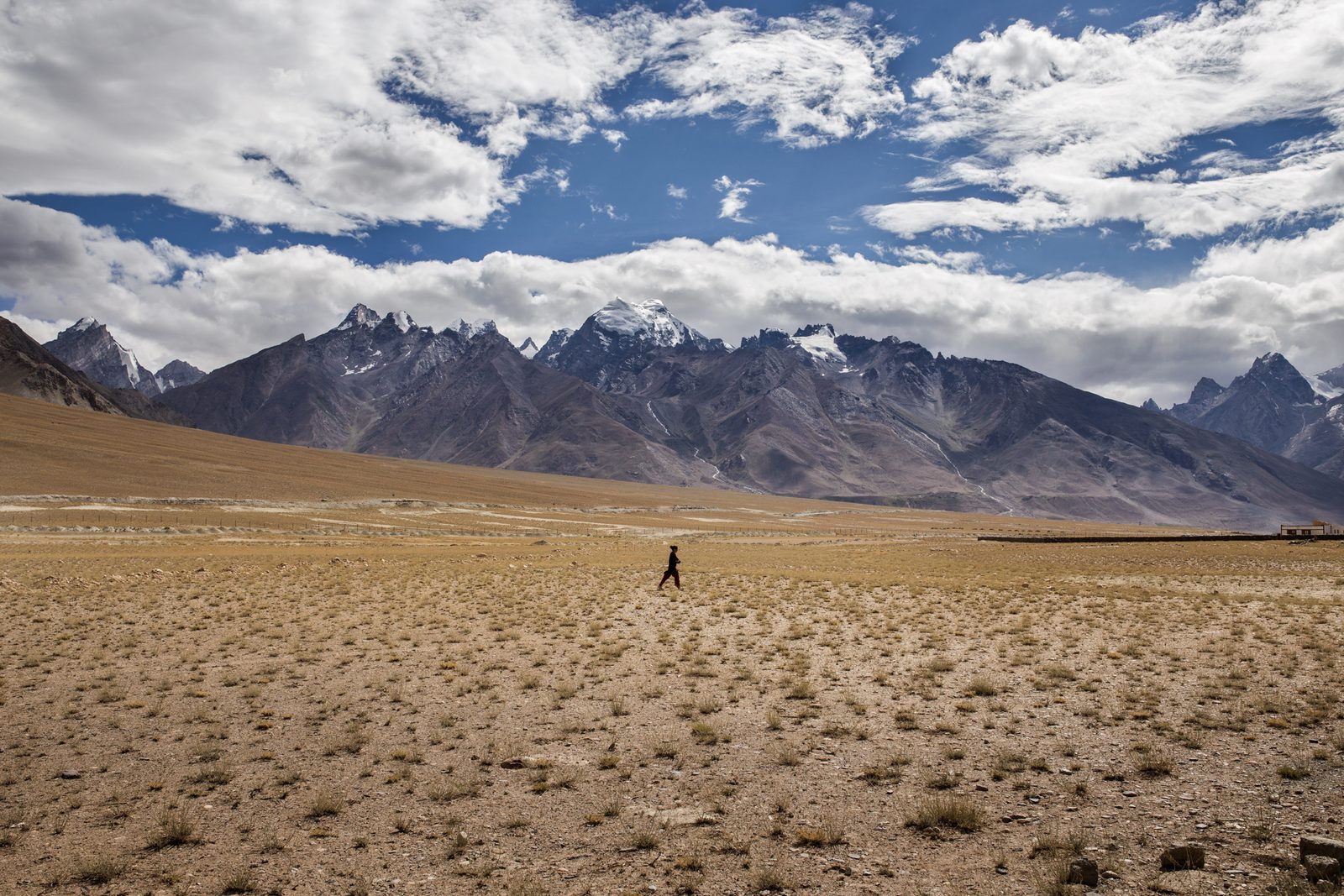 A villager of Lower Kumik walks back home